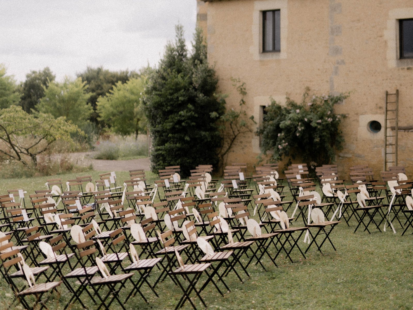 Ceremony set facing the estate's stone façade