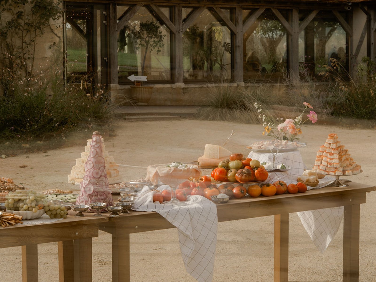 Autumn grazing table set in the courtyard, in front of the winter garden