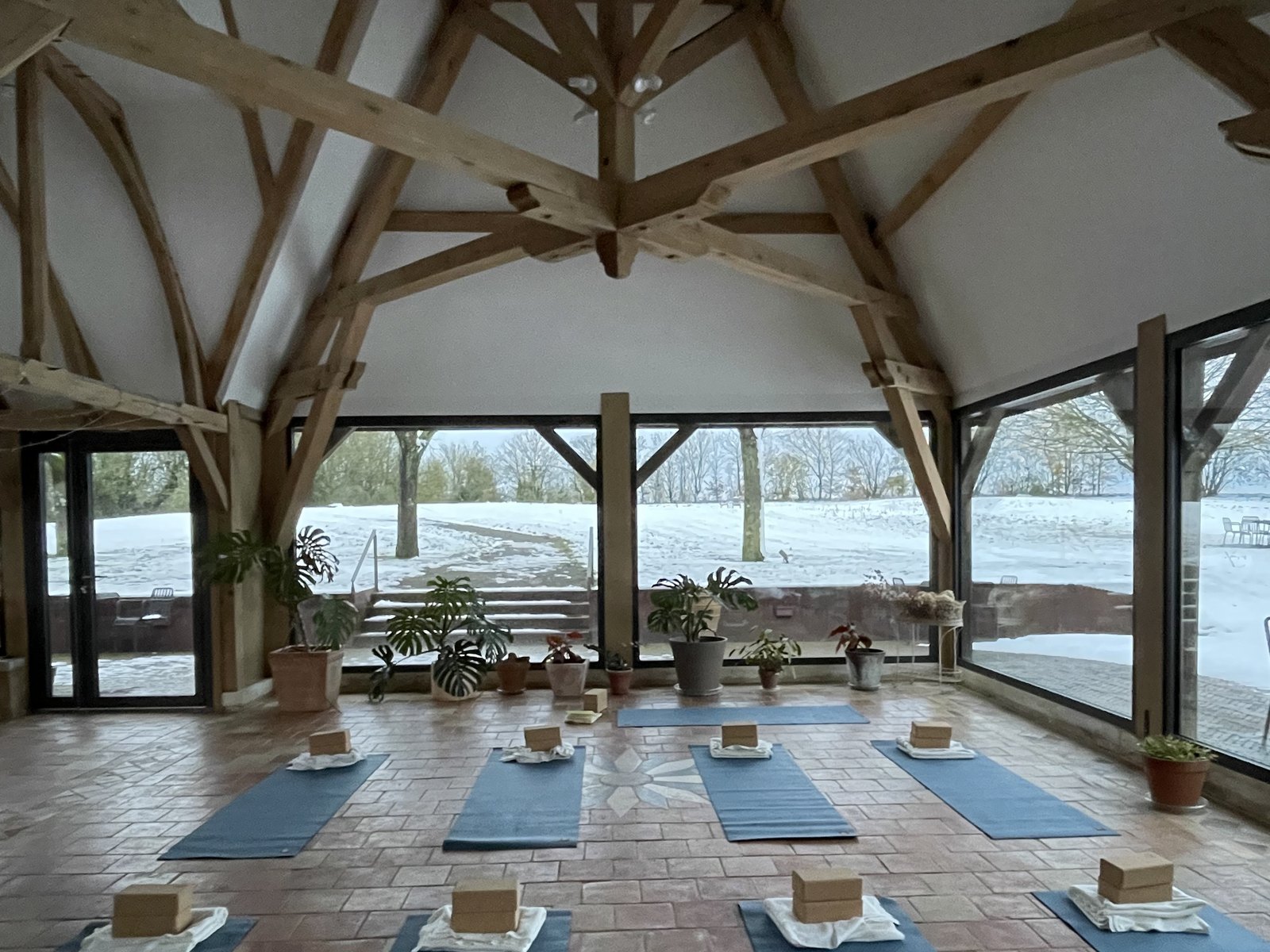 Yoga class under the winter garden's timber frame