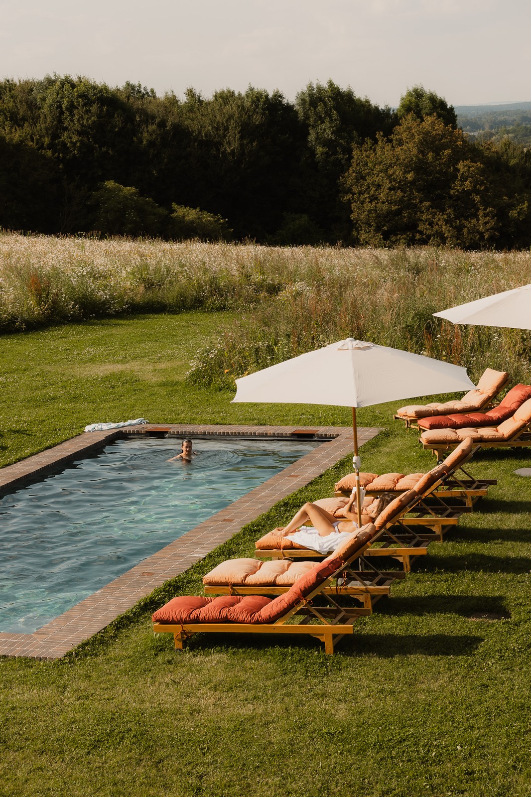 The heated pool and grounds in summer